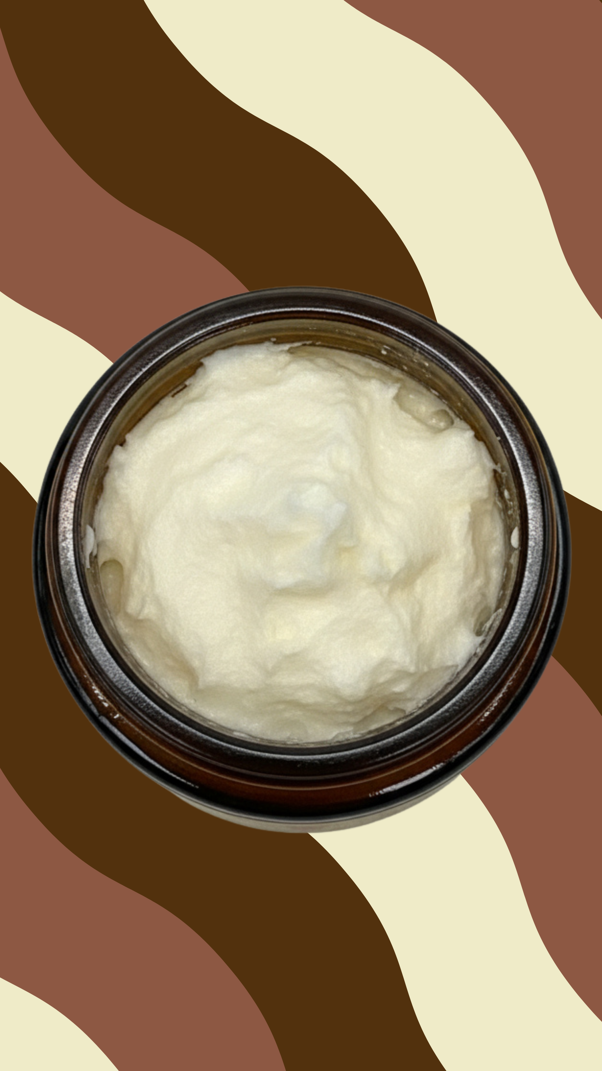 Top view of Maxine's beef tallow balm showing rich whipped texture in amber glass jar