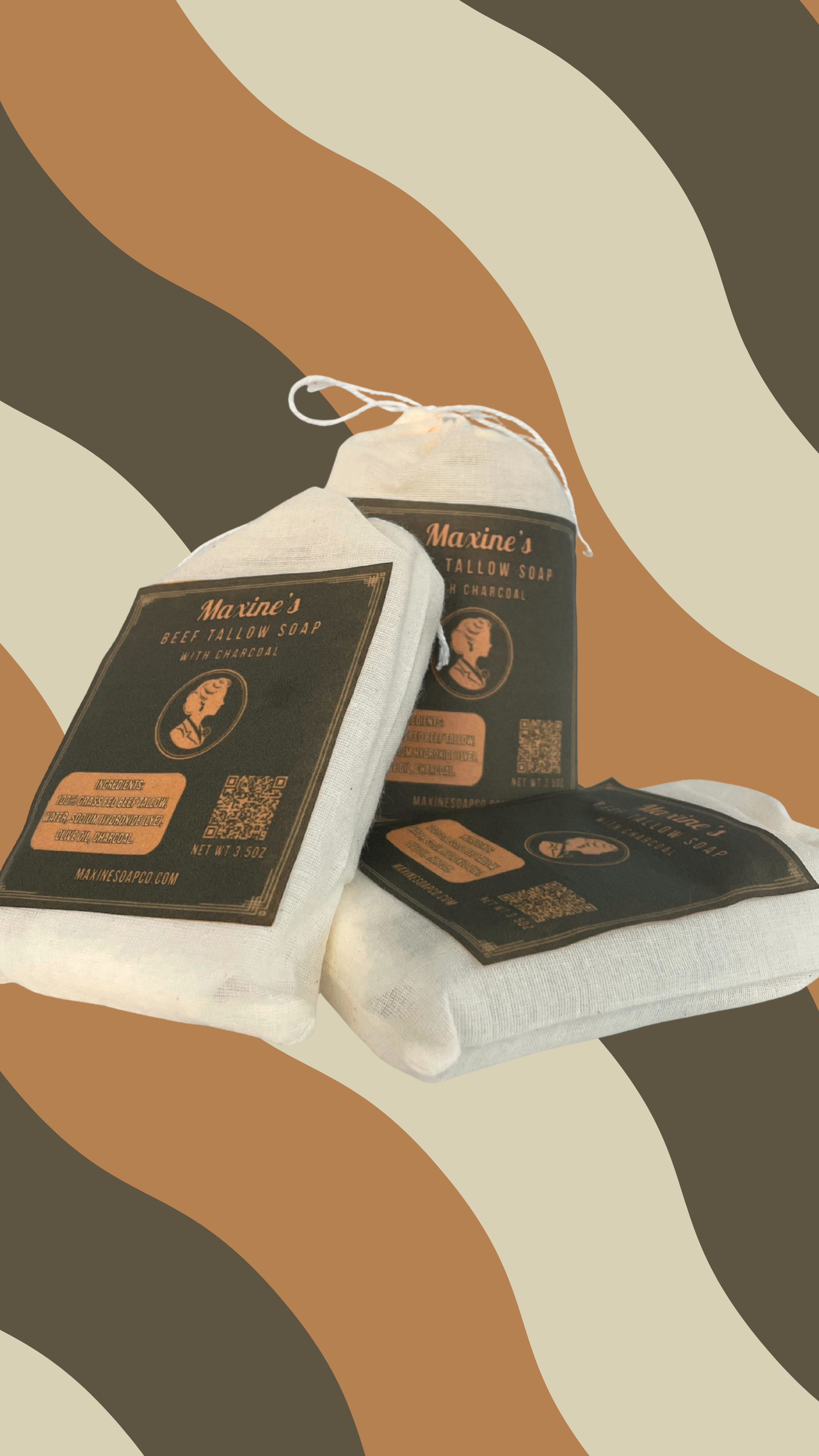 Three Maxine's beef tallow charcoal bar soaps stacked showing muslin pouch packaging handmade in Iowa
