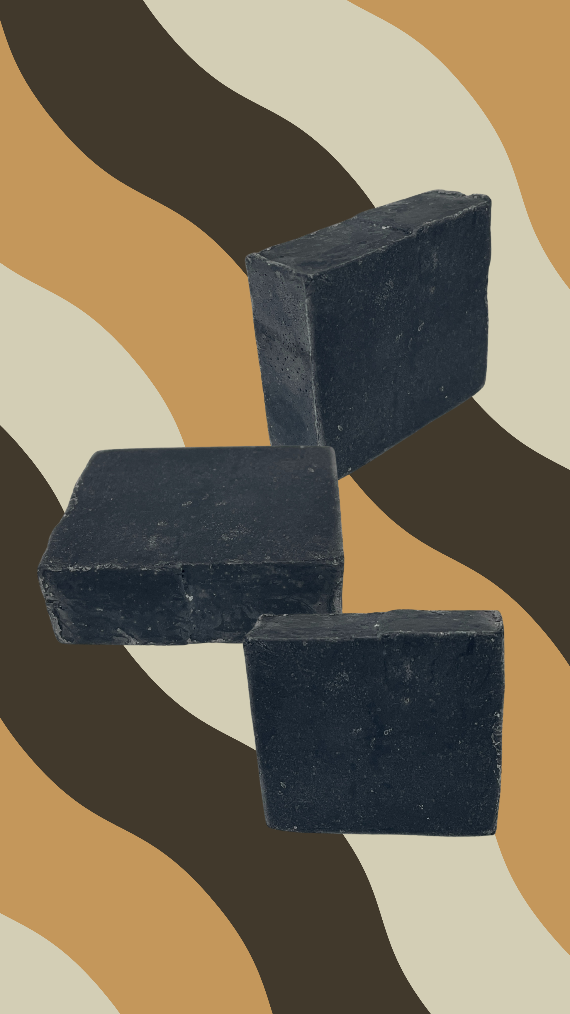 Maxine's coconut oil charcoal soap bars displayed at different angles showing black activated charcoal formula