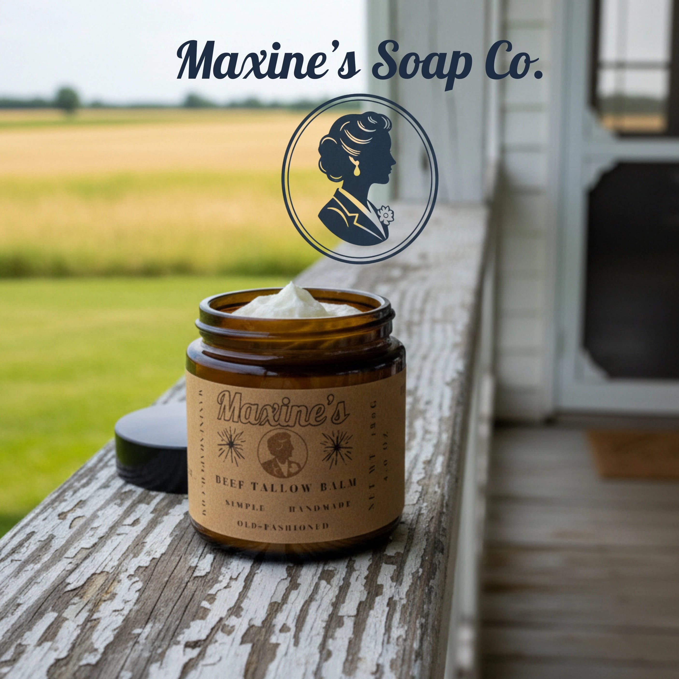 Maxine's Soap Co. balm jar on a wooden surface with a field and building in the background