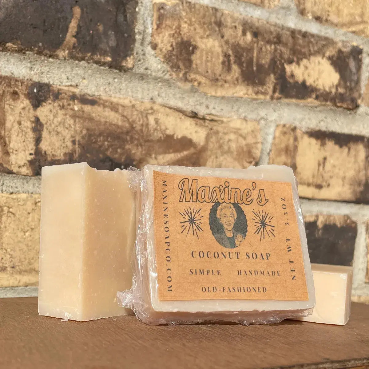 Front of wrapped Coconut Oil & Honey Bar Soap by Maxine’s, 3.5 oz (99 g), hand-wrapped with clear ingredients and net weight.