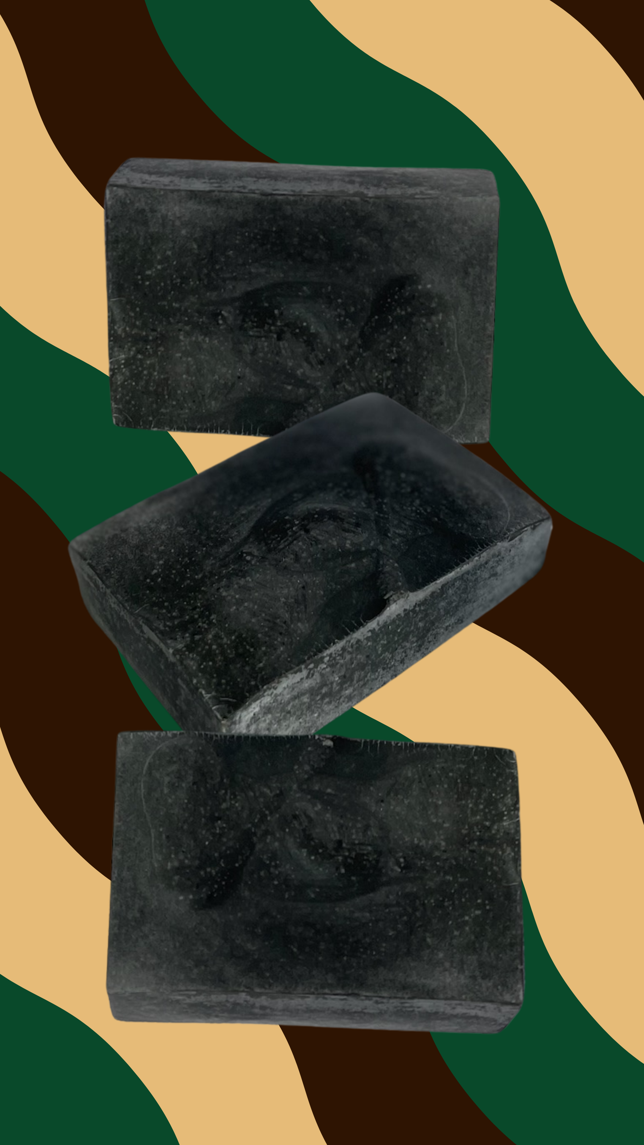 Pine tar and charcoal beef tallow soap bars showing dark charcoal color and handmade texture. Maxine's Soap Co.